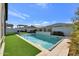 Inviting swimming pool with artificial turf and a pergola at 4752 S Orbit Ave, Mesa, AZ 85212