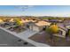 Aerial view of single-story home with garage and desert landscaping at 4907 W Faull Dr, New River, AZ 85087