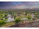 Aerial view of a community with a lake, playground, and park at 4907 W Faull Dr, New River, AZ 85087