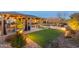 Relaxing backyard with pool, pergola, and landscape lighting at 4907 W Faull Dr, New River, AZ 85087