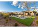 Backyard oasis with pool, patio, and artificial turf at 4907 W Faull Dr, New River, AZ 85087