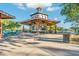 Community center with gazebo and seating area near a lake at 4907 W Faull Dr, New River, AZ 85087