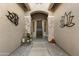 Inviting entryway with stone accents and decorative wall art at 4907 W Faull Dr, New River, AZ 85087