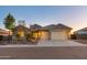 Single-story home with neutral paint, two-car garage, and landscaping at 4907 W Faull Dr, New River, AZ 85087