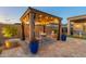 Charming pergola with string lights, perfect for outdoor dining at 4907 W Faull Dr, New River, AZ 85087