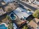 Bird's eye view of property highlighting the fenced pool, landscaping, and roof at 5045 W Mescal St, Glendale, AZ 85304