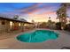 Fenced pool is the focal point of this backyard with outdoor seating and landscaping at 5045 W Mescal St, Glendale, AZ 85304