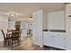 Bright dining room features hardwood floors and seamlessly flows into the kitchen at 5045 W Mescal St, Glendale, AZ 85304