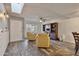 Bright living room featuring a skylight, hardwood floors, and stylish furniture at 5045 W Mescal St, Glendale, AZ 85304