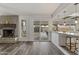 Bright living area flowing into an open kitchen with an island and backyard access through sliding glass doors at 5045 W Mescal St, Glendale, AZ 85304