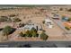 Aerial view of the property, with a red fence line and some outbuildings at 50530 W Mockingbird Ln, Maricopa, AZ 85139