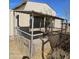 Photo of an animal enclosure highlighting the fencing and covered area for shade, located in the backyard at 50530 W Mockingbird Ln, Maricopa, AZ 85139