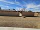 View of the backyard highlighting a fence and desert landscape, under a beautiful sky with light clouds at 50530 W Mockingbird Ln, Maricopa, AZ 85139