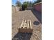 Spacious backyard area with gravel and wooden horseshoe pit at 50530 W Mockingbird Ln, Maricopa, AZ 85139