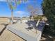 Backyard deck featuring above ground pool and desert landscaping with views, ideal for outdoor enjoyment at 50530 W Mockingbird Ln, Maricopa, AZ 85139