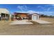 Backyard featuring an open-air shelter and a storage shed offering ample outdoor space at 50530 W Mockingbird Ln, Maricopa, AZ 85139