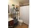 Bathroom featuring stylish vanity, decorative shelving, and tiled walls at 50530 W Mockingbird Ln, Maricopa, AZ 85139