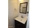 Close up of a bathroom with a modern vanity and mirror at 50530 W Mockingbird Ln, Maricopa, AZ 85139