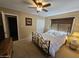 Bedroom with ceiling fan, carpet, and furnishings at 50530 W Mockingbird Ln, Maricopa, AZ 85139