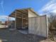 Wide view of a covered boat storage area showcasing the shelter, with a boat, and the clear, open space at 50530 W Mockingbird Ln, Maricopa, AZ 85139