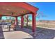 Outdoor covered patio with a dining table, chairs, and an unobstructed view of the property at 50530 W Mockingbird Ln, Maricopa, AZ 85139