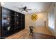 Office space featuring built-in shelving, a ceiling fan, and a wooden desk at 50530 W Mockingbird Ln, Maricopa, AZ 85139