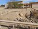 The desert tortoise habitat features a dirt mound and rock feature within a fenced enclosure at 50530 W Mockingbird Ln, Maricopa, AZ 85139