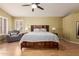 Main bedroom with wood flooring and ceiling fan at 5766 W Brown St, Glendale, AZ 85302