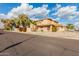 Two-story house on a residential street with a gravel front yard at 5766 W Brown St, Glendale, AZ 85302