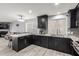 Updated kitchen featuring granite countertops and dark cabinets at 5766 W Brown St, Glendale, AZ 85302