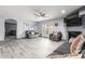 Spacious living room featuring a fireplace, sliding doors to the pool, and tile floors at 5766 W Brown St, Glendale, AZ 85302