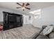 Gathering room with built-in entertainment center and staircase at 5766 W Brown St, Glendale, AZ 85302