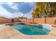 Inviting kidney shaped pool with surrounding patio and landscaping at 5766 W Brown St, Glendale, AZ 85302