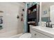 Clean bathroom with a bathtub, sink, and storage at 6033 S 19Th Pl, Phoenix, AZ 85042