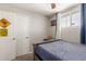 Cozy bedroom with double bed, closet, and window at 6033 S 19Th Pl, Phoenix, AZ 85042