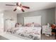 Main bedroom boasts floral bedding and white furniture at 6033 S 19Th Pl, Phoenix, AZ 85042