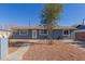 Newly painted home with front yard landscaping and walkway at 6033 S 19Th Pl, Phoenix, AZ 85042