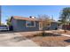 Newly painted home with driveway and front yard at 6033 S 19Th Pl, Phoenix, AZ 85042