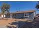 Newly painted home with front yard landscaping and walkway at 6033 S 19Th Pl, Phoenix, AZ 85042