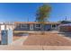 Ranch style home with front yard landscaping and walkway at 6033 S 19Th Pl, Phoenix, AZ 85042