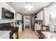 Bright kitchen features white cabinets, gas range, and microwave at 6033 S 19Th Pl, Phoenix, AZ 85042