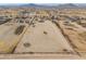 Aerial view of property showing house and large lot, distant mountains at 6210 N Poplar St, Maricopa, AZ 85139