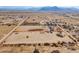 Aerial view of property showing house and large lot with property boundaries, distant mountains at 6210 N Poplar St, Maricopa, AZ 85139