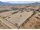 Aerial view of property showing house and large lot, distant mountains at 6210 N Poplar St, Maricopa, AZ 85139