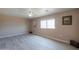 Spacious bedroom with tile floors and a window at 6210 N Poplar St, Maricopa, AZ 85139