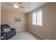 Cozy bedroom with wood-look floors and ceiling fan at 6210 N Poplar St, Maricopa, AZ 85139