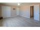 Bright bedroom with tile floors and double doors at 6210 N Poplar St, Maricopa, AZ 85139