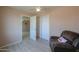 Bedroom with chair, double door closet and wood-look floors at 6210 N Poplar St, Maricopa, AZ 85139