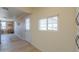 Hallway view with access door and window to backyard at 6210 N Poplar St, Maricopa, AZ 85139