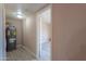 Hallway with water heater and access to bedroom at 6210 N Poplar St, Maricopa, AZ 85139